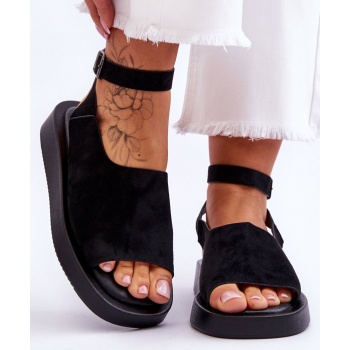 comfortable women`s sandals on a black
