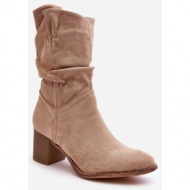  beige shaved women`s insulated boots with a gathered upper with a high heel