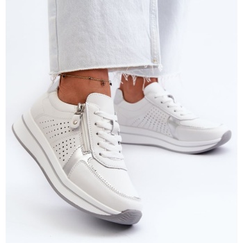 women`s leather sneakers on the white σε προσφορά