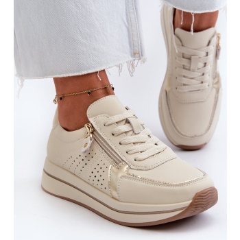 women`s leather sneakers on a beige σε προσφορά