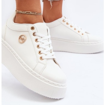 women`s low-top sneakers on a white σε προσφορά