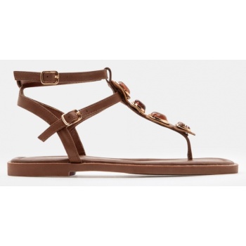 flat σανδάλια με διακοσμητικές πέτρες  σε προσφορά